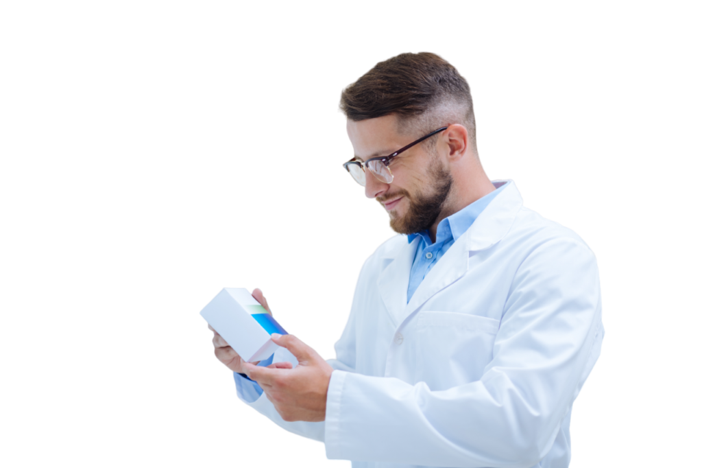 Pharmacist in a white lab coat examining a prescription box, representing professional prescription services at Edgemont Pharmacy Calgary NW.