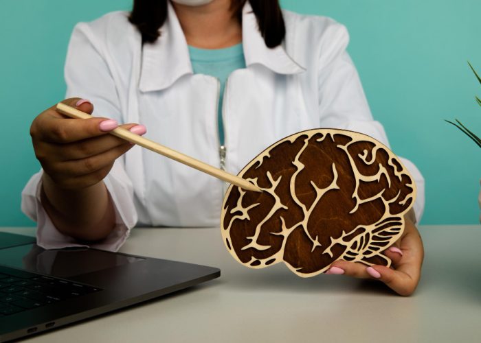 nurse-holding-wooden-brain-importance-early-diagnosis-concept